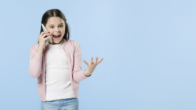 background,blue background,phone,blue,girl,mobile,space,cute,face,kid,colorful,child,social,smartphone,sweet,teenager,studio,talking,young,gadget,beautiful,expression,device,lovely,crazy,speaking,horizontal,pretty,copy,standing,crop,childhood,pupil,cheerful,shouting,screaming,little,junior,excitement,using,adorable,juvenile,copy space