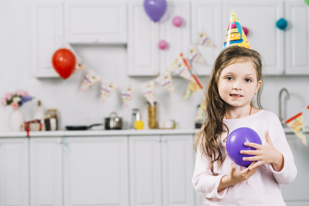 birthday,happy birthday,people,party,house,kitchen,home,cute,celebration,smile,happy,kid,balloon,event,child,purple,person,decoration,hat,decorative