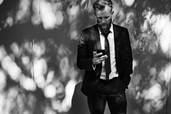 beard,business,connection,corporate,interaction,internet,man,mobile phone,networking,on the phone,online,suit,telecommunication
