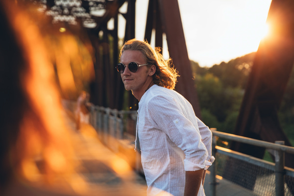25 to 30 year old,bridge,outdoors,portrait,sunglasses,sunset,two,view,walking,young,affection,affectionate,blond,blonde,caucasian,couple,enjoying,female,friends,leisure,long hair,male,relationship,selective focus,shirt,sightseeing,street,stylish,together,tourist,vacation