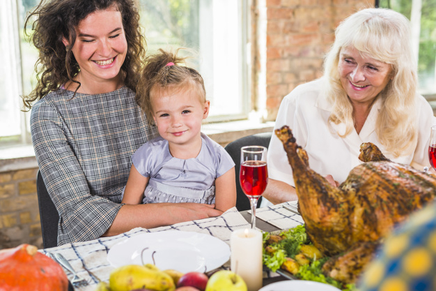 food,family,thanksgiving,table,home,fruit,chicken,celebration,holiday,mother,child,drink,candle,plate,vegetable,dinner,lady,grey,female
