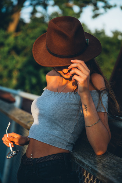 20-25 year old,dress,hat,portrait,posing,smiling,sunglasses,sunlight,sunset,young,belly button,belt,blonde,bracelet,brown hat,casual,caucasian,fashion,female,hair,joy,model,neck chain,outdoor,outside,person,shoulders,smile,style,stylish,summer,urban,woman