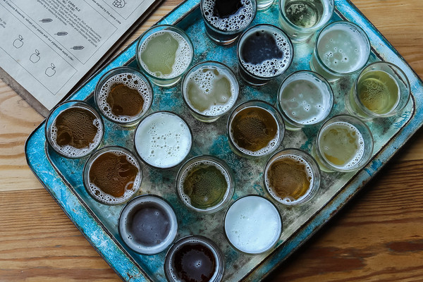 alcohol,alcoholic beverages,beer,beverage,beverages,brewery,cider,color,cup,delicious,drinks,glasses,high angle shot,refreshment,selection,shot glass,table,tasting,tray,vareity,wood