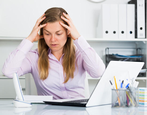 Free: Woman having problem in office 