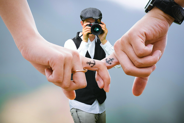 photographer,hands,love,couple,together,fingers,people,human,young,person,touch,relationship,relation,lovers,tattoo,wedding,camera,marriage,flirting,romance,relaxation,groom