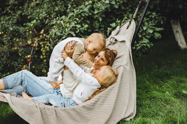 having,cuddle,resting,lying,little,daughter,son,relaxing,hammock,childhood,outdoors,playing,horizontal,adult,day,hug,lifestyle,beautiful,happiness,dad,young,together,female,outdoor,care,old,fun,mom,natural,park,person,white,child,women,mother,kid,garden,happy,smile,cute,home,sun,girl,nature,woman,summer,family,children,kids,love,people