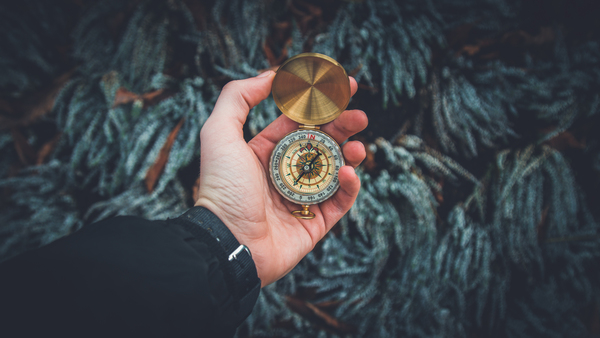 close-up,compass,direction,discovery,exploration,explore,explorer,gold,hand,holding,navigation,person,time,Free Stock Photo