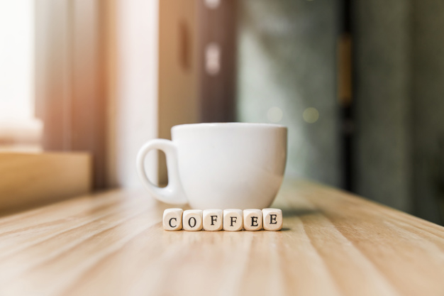 coffee,wood,restaurant,table,shop,text,letter,shape,coffee cup,desk,cup,breakfast,cube,mug,wooden,coffee shop,wood table,word,simple