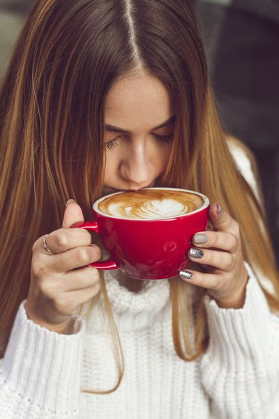 Free Photo  Girl drinking a cup of coffee