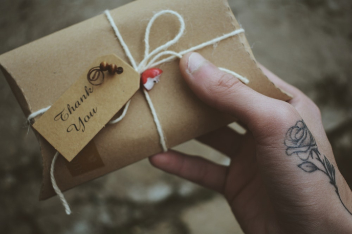 brown,card,christmas present,close-up,hand,handwriting,love,note,person,tattoo,thank you,writing