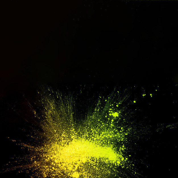 Free: Elevated view of yellow color powder explosion on black background -  