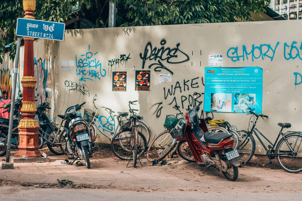 bicycles,bikes,graffiti,motorbike,siem reap,street,street art,transportation system,vandalism,vehicle,wall,wall art