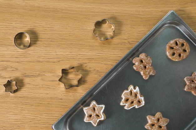 christmas,food,wood,star,xmas,table,ice cream,shape,desk,sweet,cookies,dessert,symbol,brown,christmas star,life,wooden,cookie,wood table,traditional,cream,sugar,recipe,snack,baking,christmas food,pastry,christmas table,bench,biscuit,tray,high,homemade,cutting,inside,baked,seasonal,icing,making,still,treat,shaped,closeup,overhead,indoors,nobody,cutters,elevated