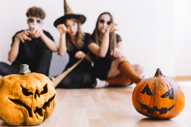 party,halloween,red,autumn,space,celebration,orange,black,makeup,decoration,drink,fall,teenager,pumpkin,zombie,young,witch,masquerade,sitting,focus