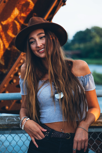 20-25 year old,dress,hat,portrait,posing,smiling,sunglasses,sunlight,sunset,young,beaded bracelets,belly button,belt,blonde,brown hat,casual,caucasian,fashion,female,hair,joy,model,outdoor,outside,person,shoulders,style,stylish,summer,toothy smile,urban,woman