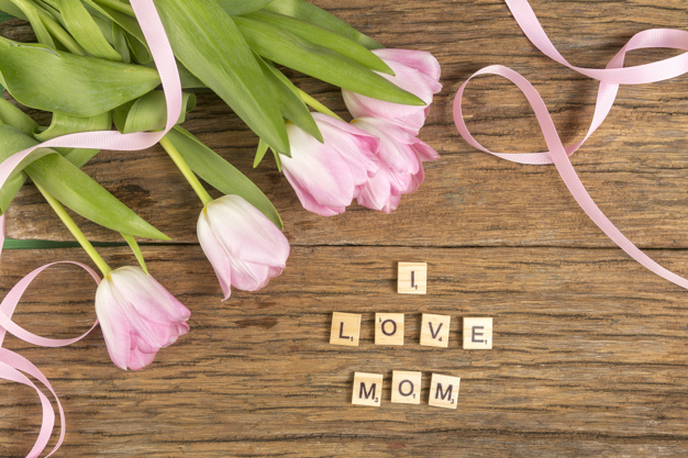 scattered,lay,arrangement,bunch,i love mom,inscription,phrase,composition,bloom,horizontal,tulips,flat lay,petal,mothers,top view,top,day,bright,beautiful,view,tulip,blossom,wooden background,fresh,word,bouquet,wooden,message,mom,natural,decoration,plant,flat,present,letter,event,holiday,colorful,text,celebration,spring,cute,mothers day,pink,table,green,leaf,gift,design,love,floral,ribbon,flower,background