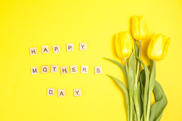 lay,arrangement,inscription,phrase,composition,bloom,horizontal,tulips,flat lay,petal,mothers,three,greeting,top view,top,day,decor,bright,beautiful,view,tulip,blossom,fresh,word,happy mothers day,wooden,message,natural,decoration,plant,flat,yellow background,present,yellow,letter,event,holiday,colorful,text,happy,celebration,spring,cute,table,green,leaf,gift,design,floral,flower,background