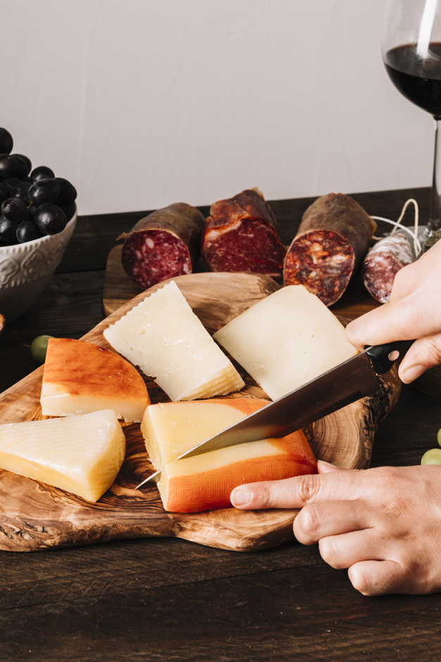 food,hands,table,luxury,space,board,person,organic,healthy,cheese,healthy food,wooden,traditional,wood table,rustic,knife,fresh,snack,wooden board,meal