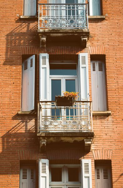 architecture,wall,brick,window,door,building,lifestyle,plant,garden,building,window,brick,architecture,balcony,house,facade,old,stone,plant,flower pot,residential