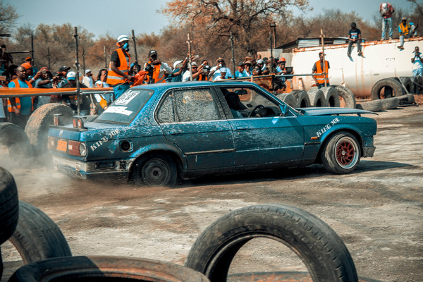 accident,action,automobile,battle,car,daytime,dirt,drag race,group,men,mud,outdoors,people,race,road,sand,street,tires,transportation system,vehicle,wheel