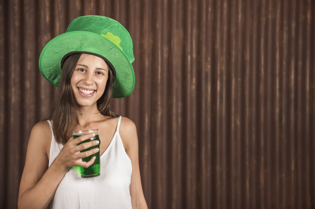 looking at camera,copy space,st,ale,patricks,pleasure,cheerful,leprechaun,saint,looking,copy,tradition,horizontal,drunk,irish,drinking,beverage,st patricks day,lucky,celtic,season,day,festive,happiness,spring background,celebration background,wooden background,young,female,party background,traditional,alcohol,womens day,wooden,friendship,background green,lady,symbol,fun,hat,drink,glass,decoration,happy holidays,wood background,holiday,happy,celebration,spring,space,green background,beer,camera,green,woman,party,background
