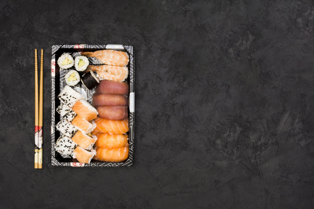 Assortment of Sushi Roll Set on a Black Tray. Japanese Food Stock