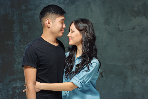 Young romantic couple posing for wedding photo outdoors Stock Photo - Alamy