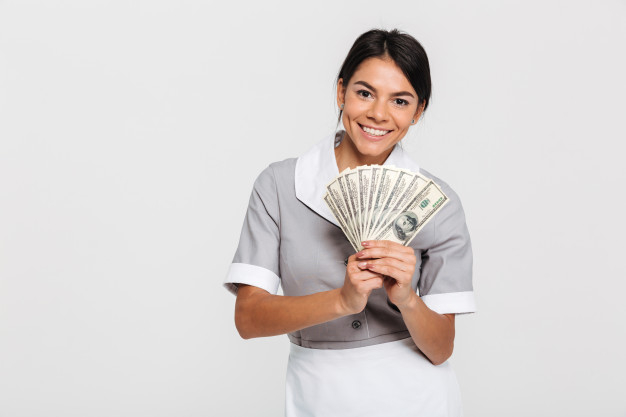 toothy,caucasian,banknotes,servant,bunch,brunette,housework,domestic,housekeeper,attractive,counting,housekeeping,standing,looking,smiling,housewife,occupation,maid,hygiene,adult,holding,profession,cleaner,currency,fan,professional,uniform,young,female,cash,dollar,lady,clean,service,worker,cleaning,work,home,girl,woman,money,hand,house