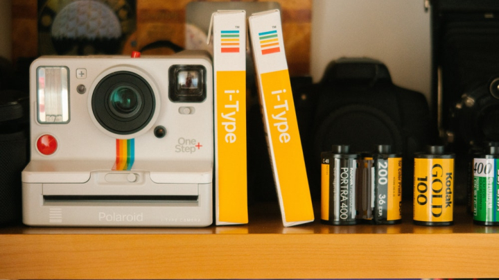 analog,analogue,antique,aperture,boxes,camera,classic,close-up,equipment,films,instant,instant camera,instant film,lens,photography,plastic,polaroid,retro,roll films,technology,vintage,yellow