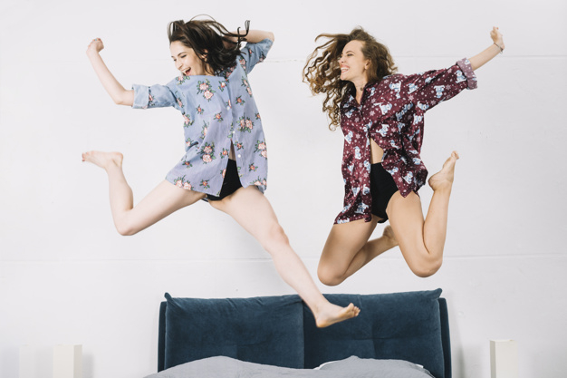 pattern,floral,people,house,woman,fashion,home,beauty,floral pattern,smile,happy,bed,fun,funny,model,youth,bedroom,female,young,happy people,jump,happiness,fashion model,beauty woman,jumping,motion,cheer,adult,pretty,stylish,smiling,two,casual,cheerful,bonding,fashionable,enjoying,closeup,indoors,carefree,midair