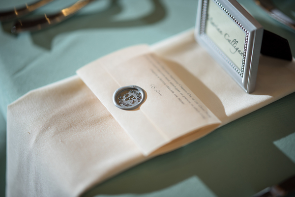 cloth,conceptual,design,document,frame,indoors,invitation,notes,paper,paperwork,seal,table,textile,writing