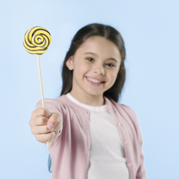 background,blue background,camera,blue,cute,candy,kid,colorful,child,square,teenager,dessert,studio,sweets,young,beautiful,portrait,bright,lollipop,focus