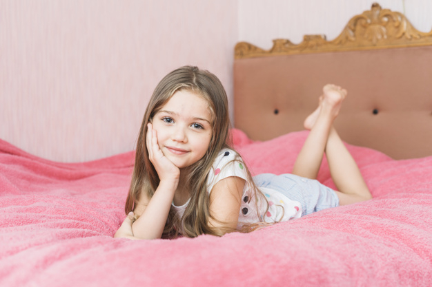 people,hair,home,beauty,pink,face,cute,smile,kid,child,room,human,person,bed,relax,bedroom,beautiful,portrait,cute girl,lifestyle