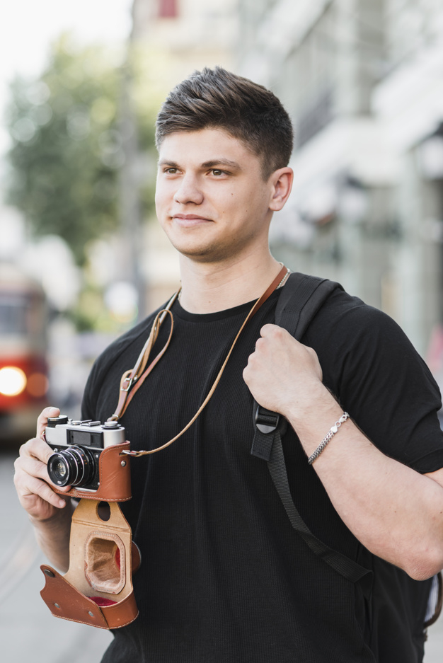 vintage,city,camera,man,retro,cute,street,photographer,vacation,old,trip,young,backpack,lifestyle,tourist,positive,male,traveler,hobby,holding