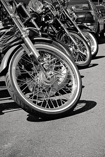 black and white,brake,car,chrome,daytime,motorcycles,parked,pavement,rims,road,street,tires,transportation system,wheels,Free Stock Photo
