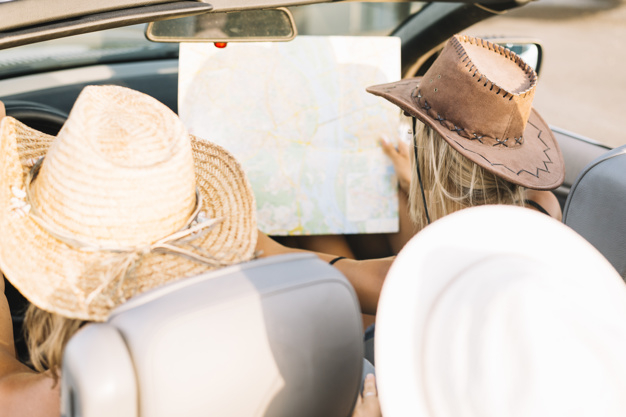 car,people,travel,summer,map,road,hat,speed,transport,motor,lady,cowboy,road map,trip,female,young,fast,back,vehicle