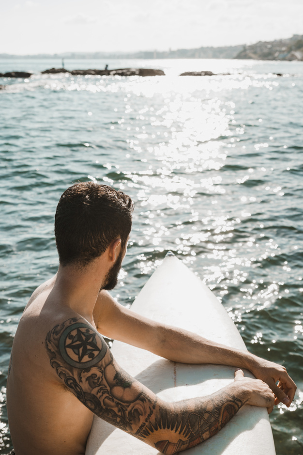 water,summer,man,sport,sea,sky,space,tattoo,vacation,weather,relax,young,view,lifestyle,male,surfboard,guy,sunny,hobby,rest
