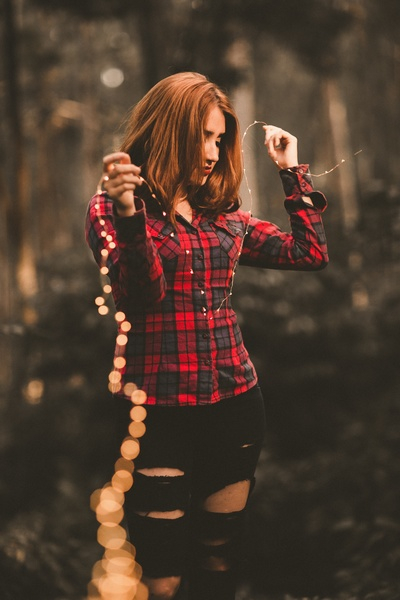 people,woman,girl,ripped jeans,outdoor,string,lights,bokeh