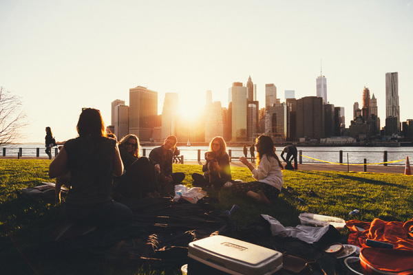 girls,women,people,friends,students,smile,smiling,happy,fun,picnic,grass,outdoors,sunset,skyline,buildings,architecture,city,New York,sky,group