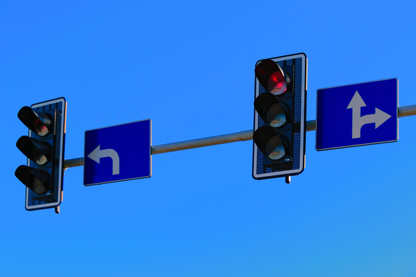 traffic sign,traffic lights,symbol,stoplights,sky,sign,road sign,red light,lights,clear sky,blue sky,arrows