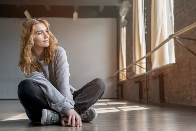 A Little Girl on a Wooden Floor Stock Image - Image of cute, rest