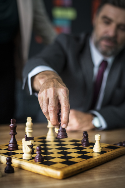 achievement,adult,battle,black,board,business,businessman,check,chess,chess piece,chessboard,choice,competition,conflict,decisions,defense,focus,game,hand,horse,king,knight,leadership,management,mate,moving,pieces,plan
