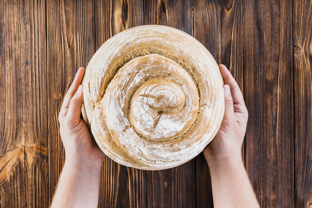food,people,circle,hand,bakery,kitchen,table,health,human,person,bread,swirl,organic,breakfast,round,healthy,spiral,dessert,eat,brown