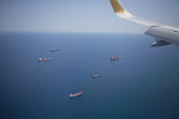 airplane,freight,ocean,ship,sky,skyline,wing,aerial,aircraft,background,bird view,cargo,carrier,commercial,cruise,export,journey,logistics,sea,shipment,shipping,trade,transport,transportation,travel,vessel