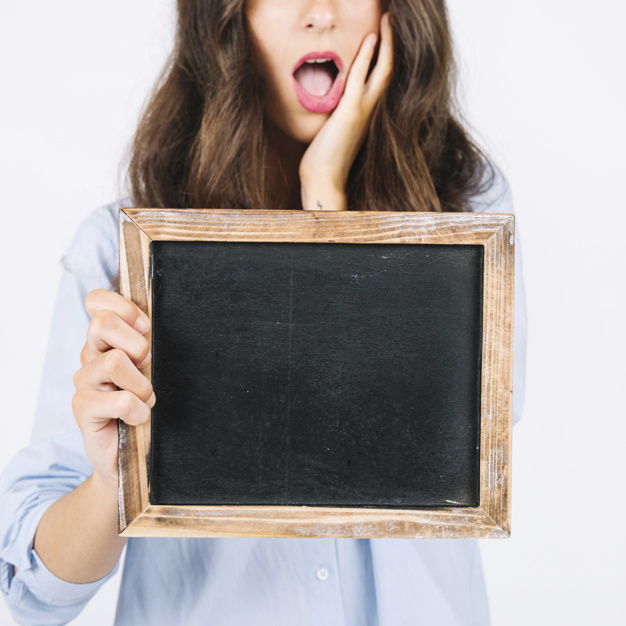 face,board,chalkboard,mouth,surprise,female,young,good,expression,holding,surprised,slate,looking,good looking,with