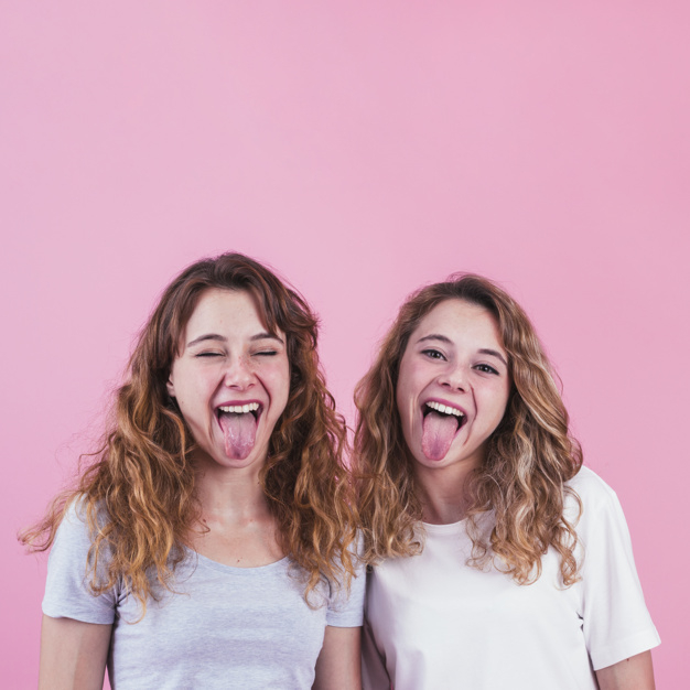 background,hair,pink,face,happy,pink background,friends,mouth,fun,funny,open,lady,studio,friend,friendship,youth,female,together,young,woman face