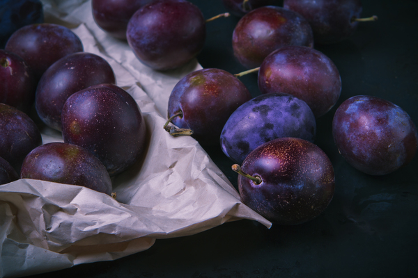 close up,dark background,fresh,fruit,plums