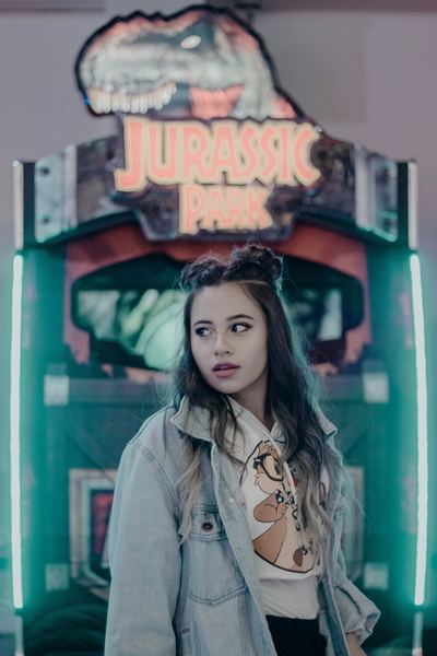 woman,white,girl,person,portrait,woman,person,girl,woman,woman,female,sign,lights,jurassic park,gamer,gaming,fashion,style,outdoors,arcade,model,creative commons images