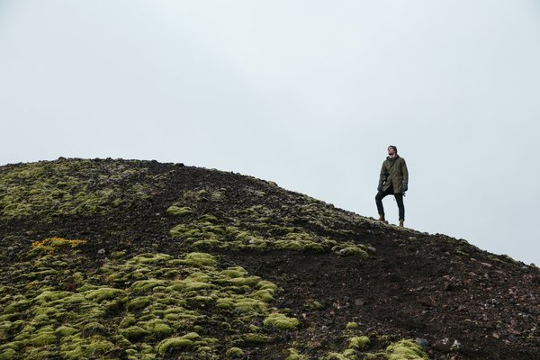  man,moss,rocks,hills,person,icel, photographer