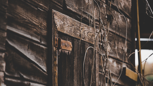 wooden,wood,wall,rusty,rustic,outdoors,iron,house,exterior,door,dirty,decay,daylight,dark,abandoned
